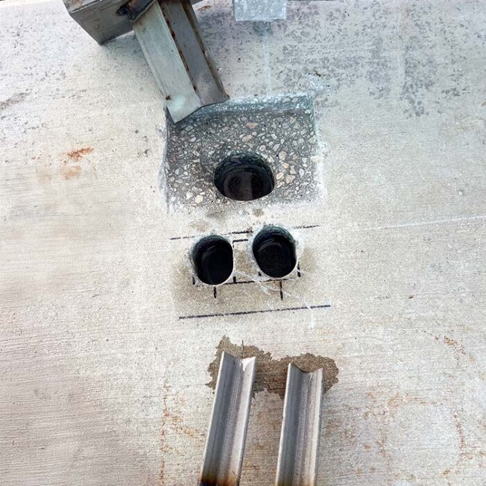Concrete cutting and coring drilling for a Stainless Steel gate stop and latch system.