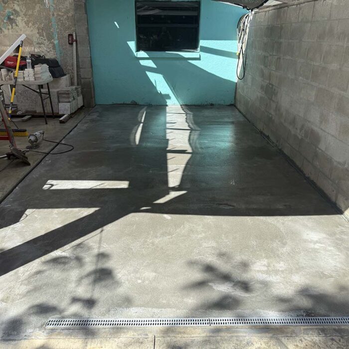 Finished concrete overlay. Floor now will drain properly to the floor drain.