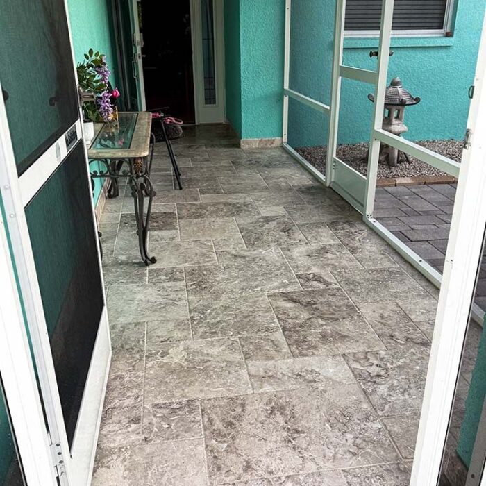 Finished Marble Stone tile with screen on front porch expansion.