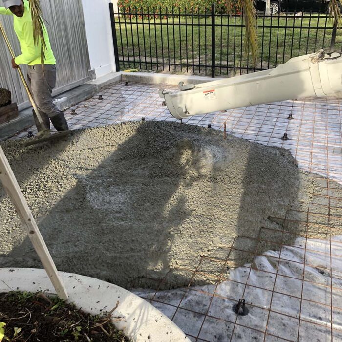 Driveway pour with high gage wire mesh and #5 rebar on leading edges