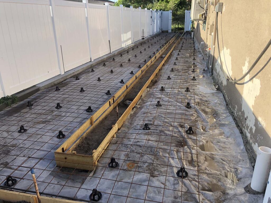 Concrete slab pour with trench drainage cut out