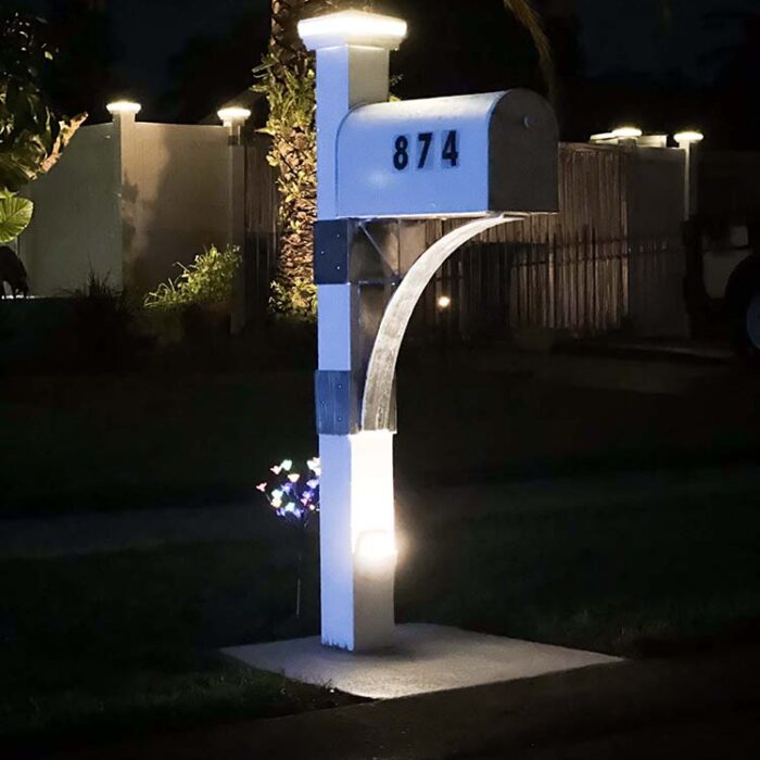 New Mailbox Post with low voltage lighting and Aluminum support structural. Reinforced concrete dowelled into the curb insures a permanent placement.